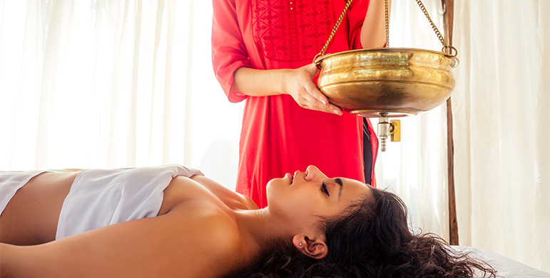 Ayurvedic massage and yoga session by Kerala backwaters