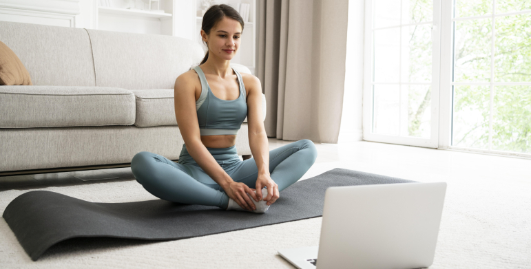 Woman consulting yoga teacher online