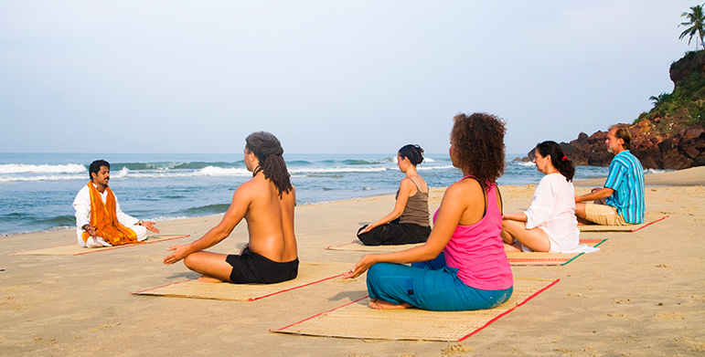 Different styles of eco-friendly retreats in India, including yoga and Ayurveda centers