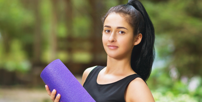 Woman comparing certified yoga instructors at home in Noida