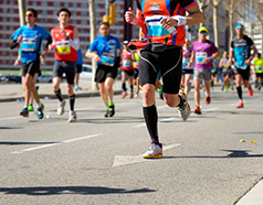Professional runners competing in Gujarat premier Adani Ahmedabad Marathon featuring full marathon and half marathon categories