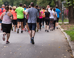 Runners participating in Tata Mumbai Marathon 2026 with energetic city atmosphere and large crowd